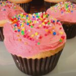 Soft and fluffy vanilla cupcakes with creamy buttercream frosting, perfect for birthdays and kids' parties.
