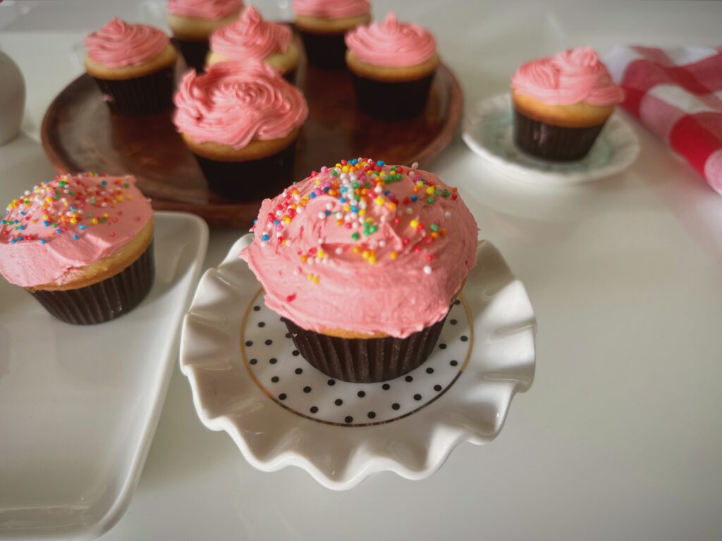 Soft and fluffy vanilla cupcakes with creamy buttercream frosting, perfect for birthdays and kids' parties.