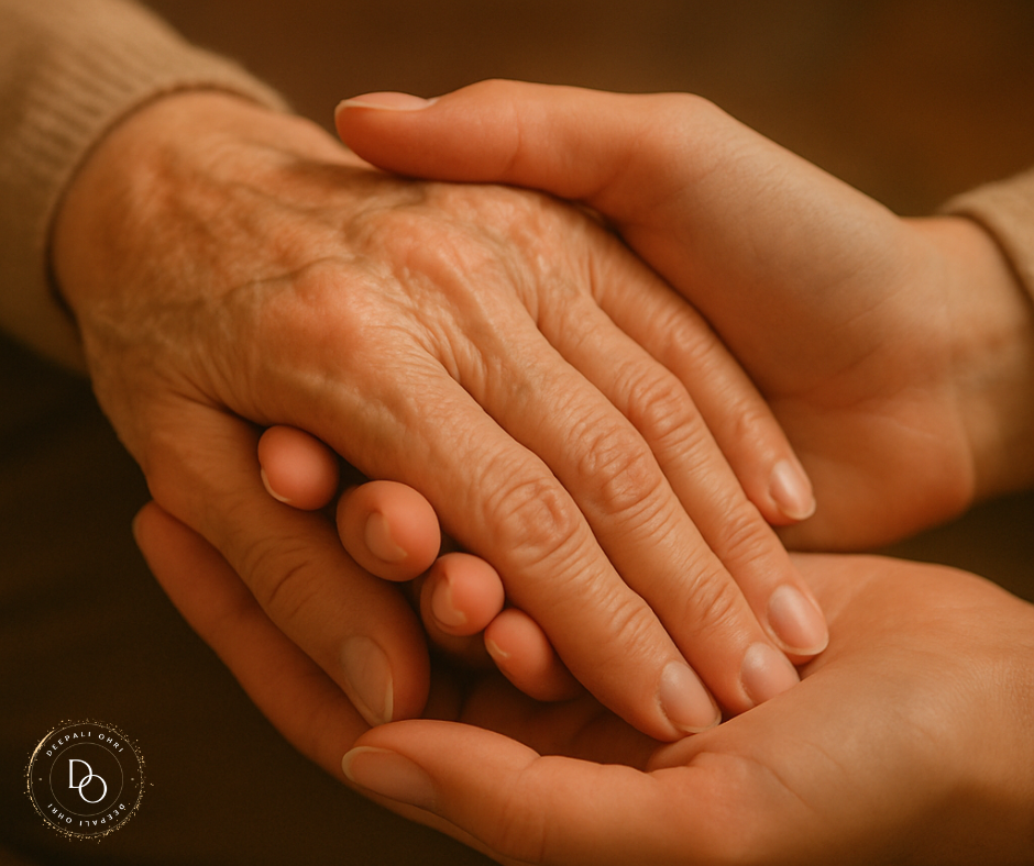 Close-up of a younger hand gently holding an older hand, both bathed in soft, warm light.