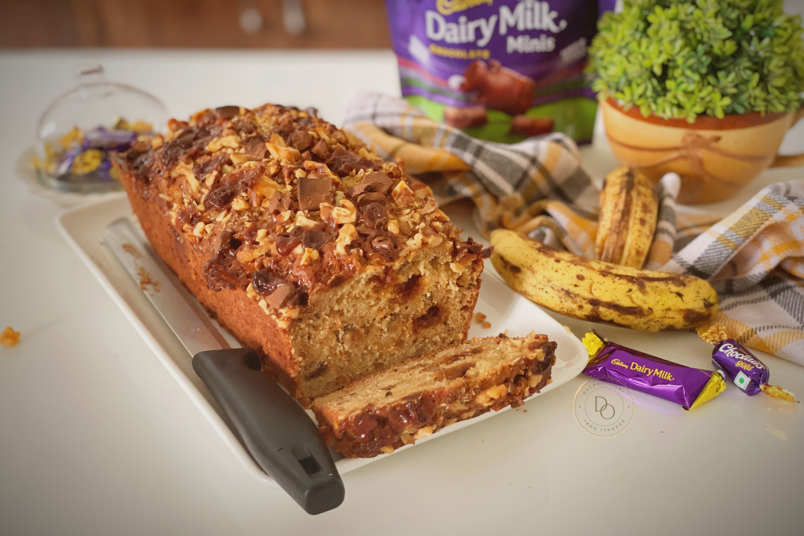 Slice of banana streusel bread with caramel toffees, chocolate chunks and walnuts showing the moist texture