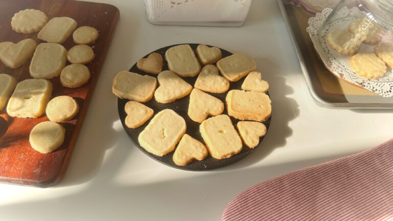 Only 3 Ingredient Butter Cookies Three ingredient butter cookies arranged on a white plate, some broken in half to show crispy texture