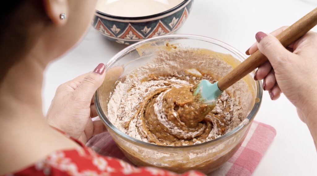 Folding flour into wet mix for Eggless Date & Carrot Cake batter