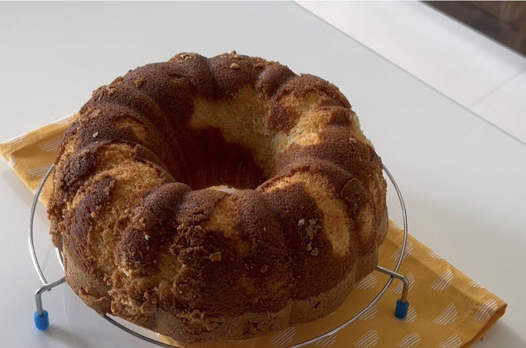 Vanilla bundt cake with a few patches stuck on top, before glazing