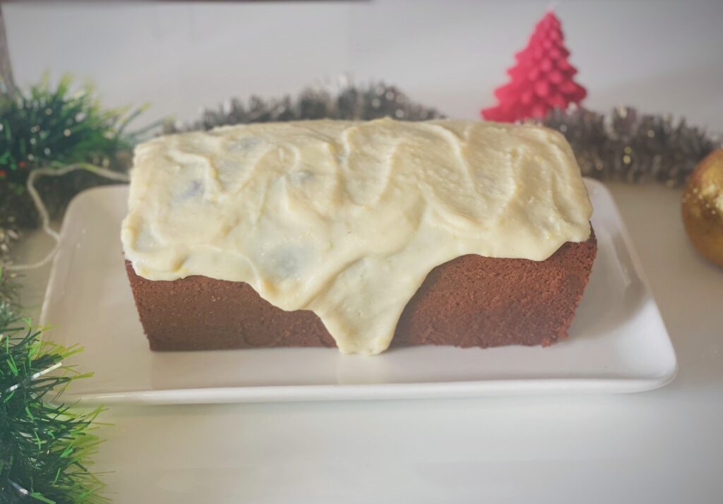 Lime glaze dripping down the sides of a condensed milk pound cake