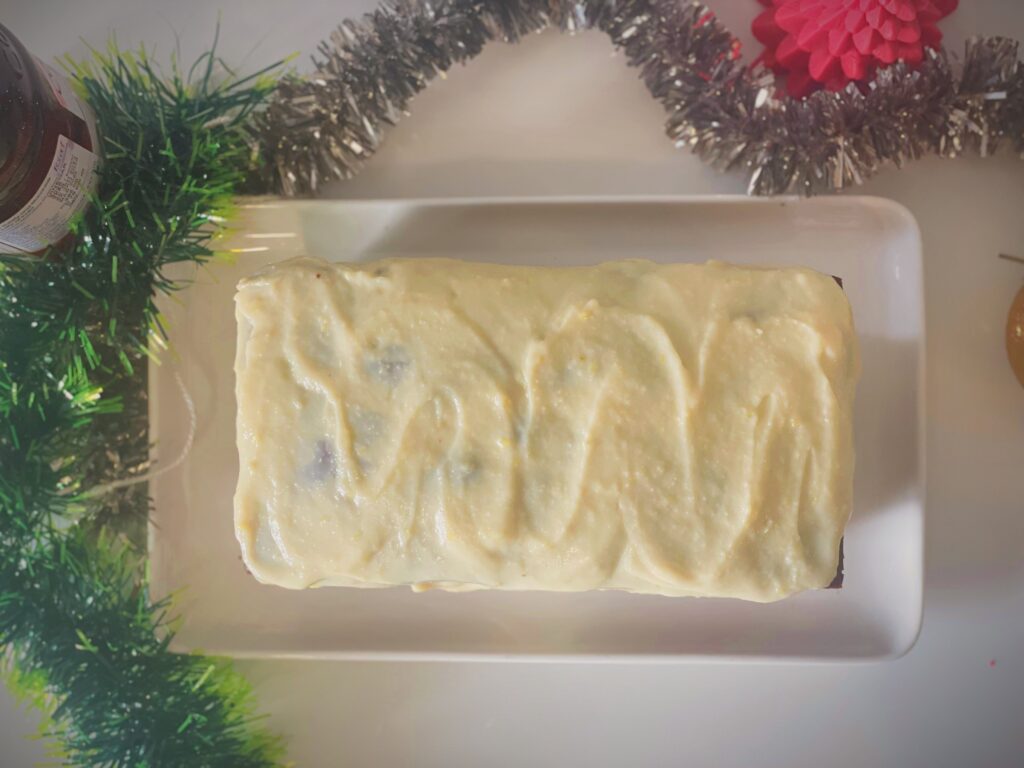 Overhead view of a lime-glazed condensed milk pound cake loaf