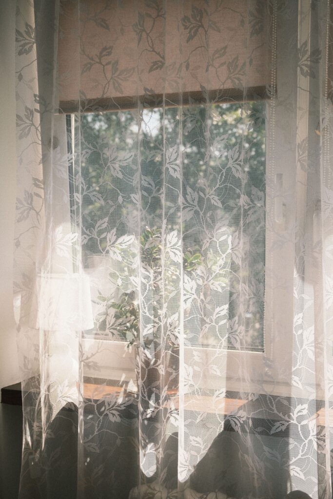 Soft morning light streaming through a window into a calm, quiet room