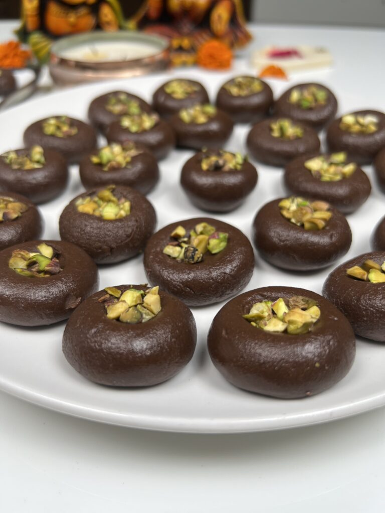 Close-up of soft chocolate pedas topped with chopped pistachios